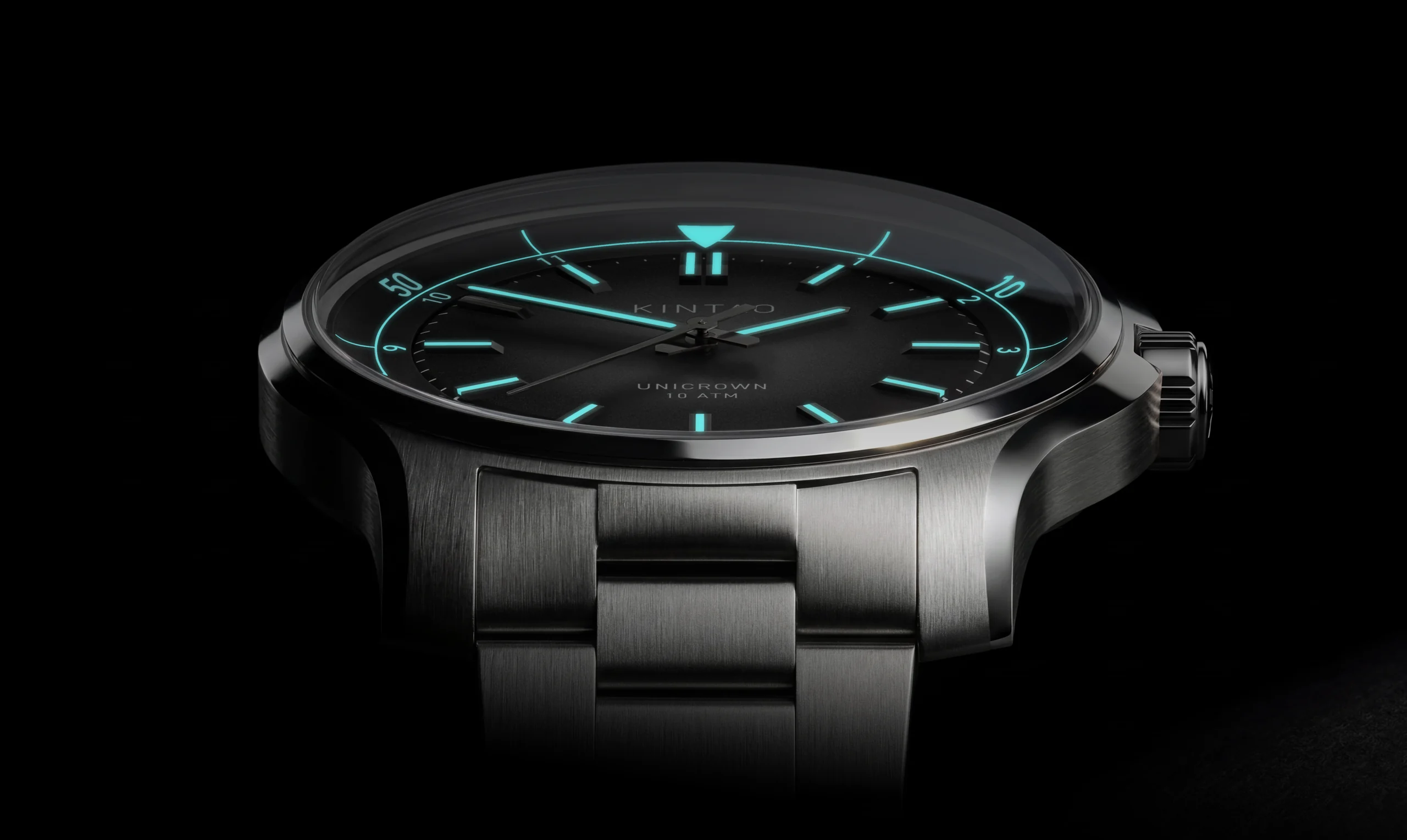 Kintao Chapter 1 on the bracelet, low three-quarter view with the lume glowing